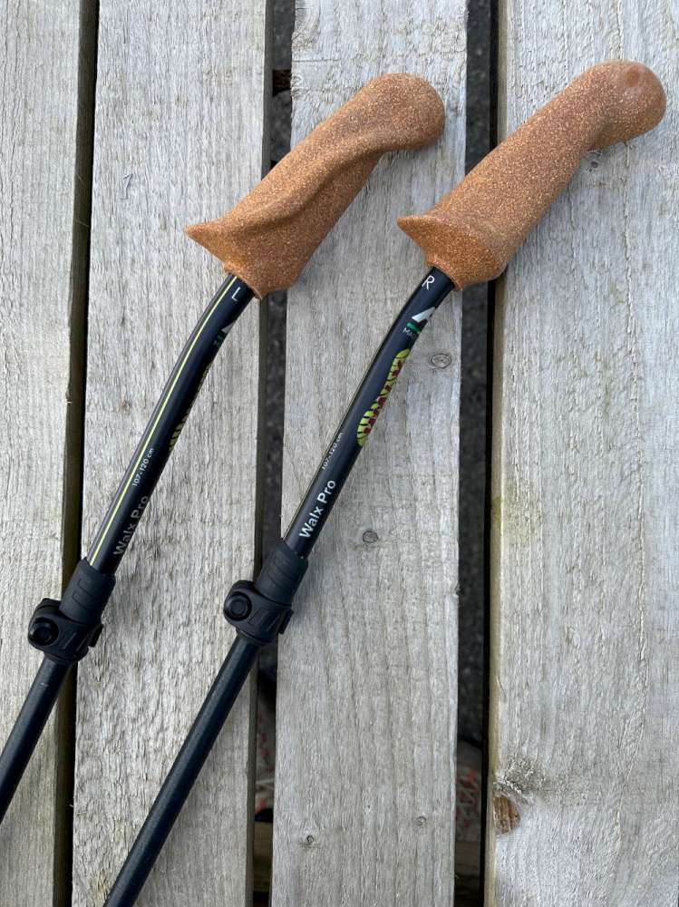 Pair of WALX Pro poles with cork  Ergo Grip Handles on a wooden surface
